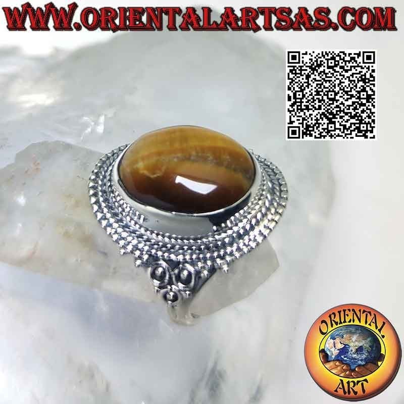 Anillo de plata con gran ojo de tigre y decoración de microesferas.