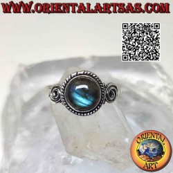 Silver ring with round cabochon labradorite surrounded by balls and spirals on the sides