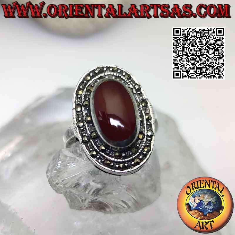 Silver ring with raised oval carnelian surrounded by two rows of marcasite