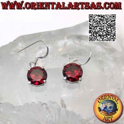 Silver earrings with round faceted garnet set in a smooth double frame