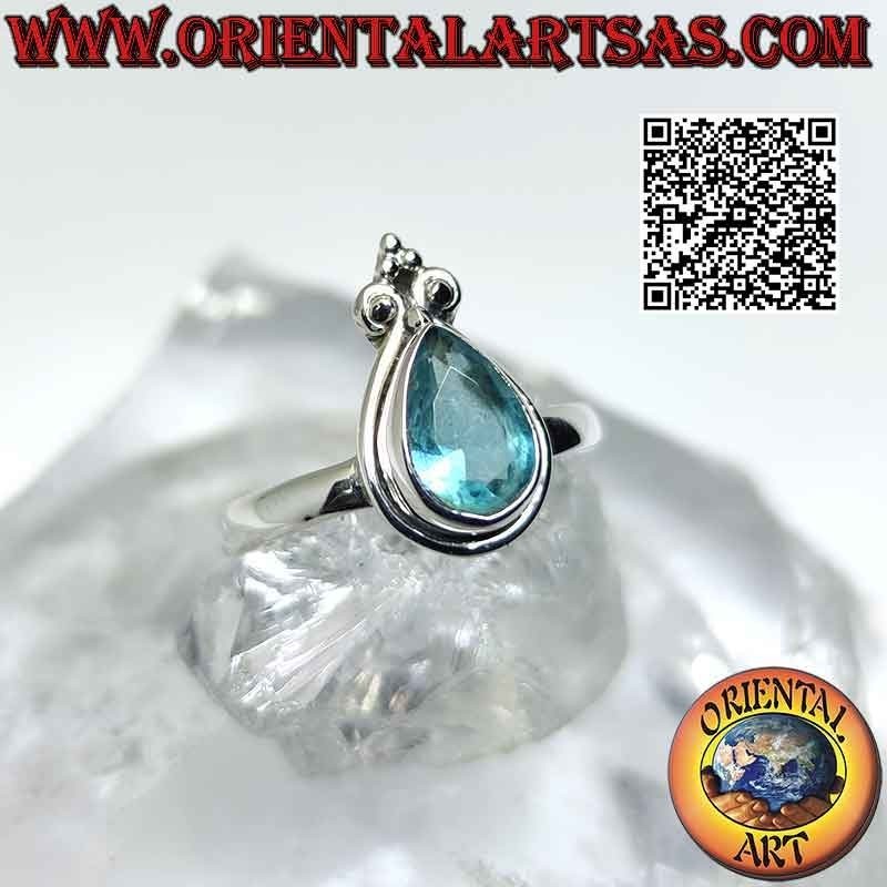 Bague en argent avec topaze bleue en forme de larme et lis de la couronne