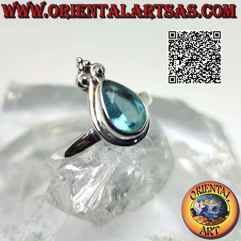 Bague en argent avec topaze bleue en forme de larme et lis de la couronne