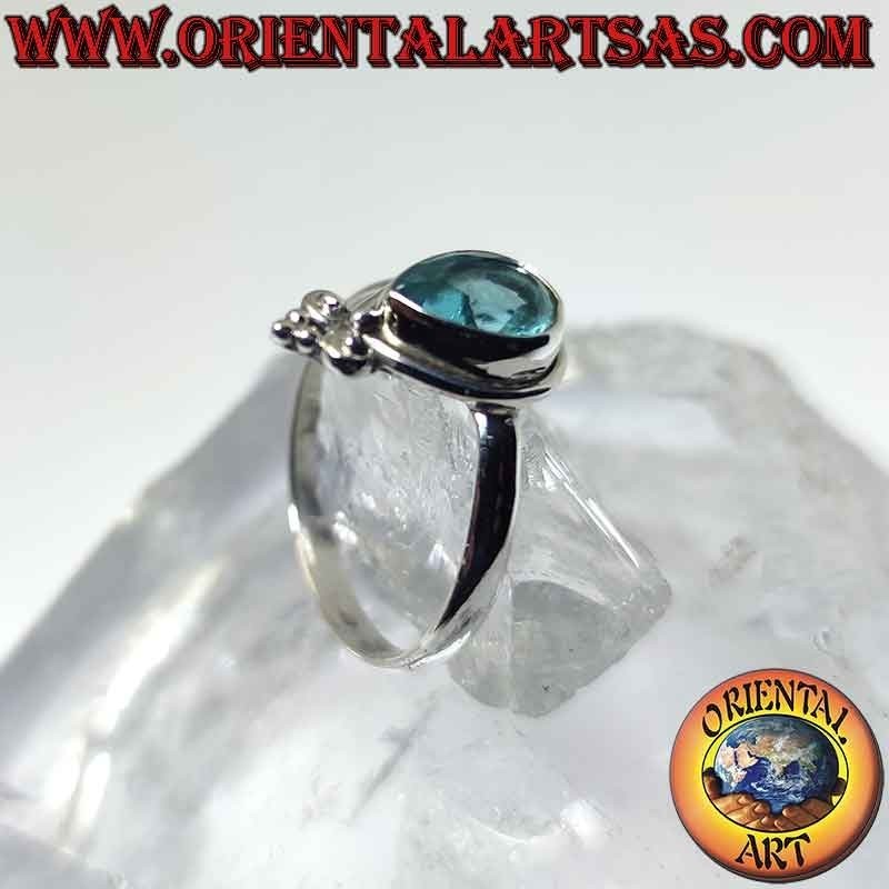 Silver ring with teardrop blue topaz and crown lily