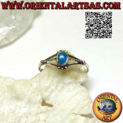 Silver ring with small oval turquoise between trio of balls and triple hook on the sides