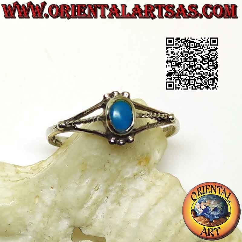 Silver ring with small oval turquoise among trio of balls