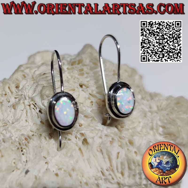 Silver earrings with oval harlequin opal flush with the edge and thick smooth edge