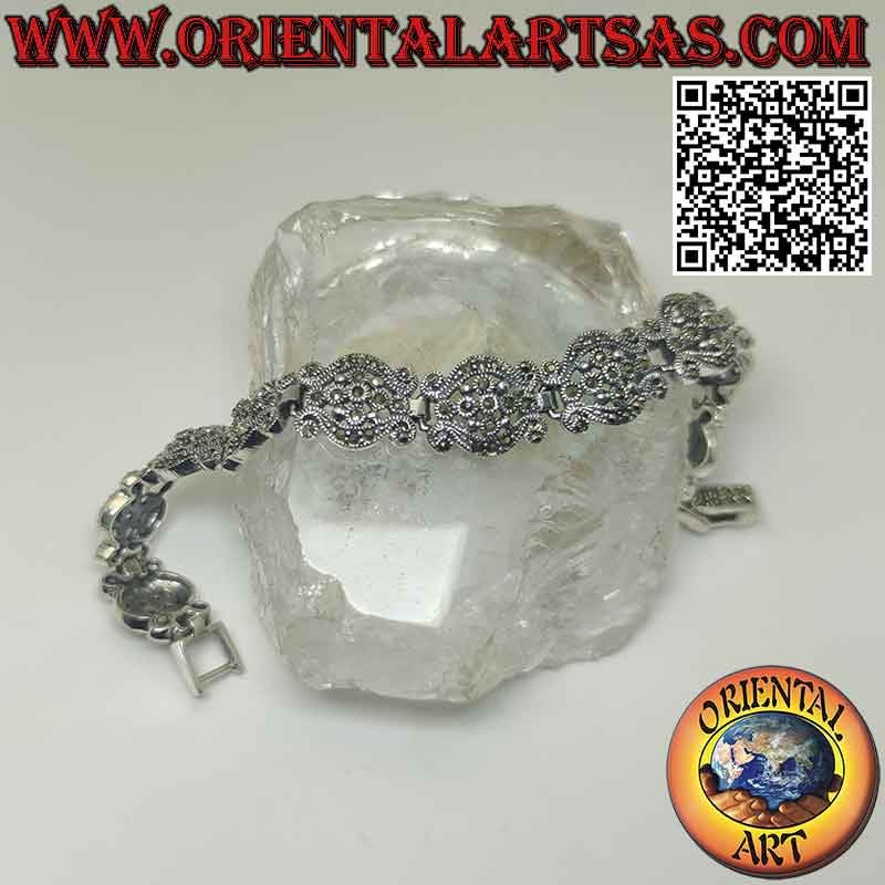 Pulsera en plata 925‰ con 10 pares de ondas con flor central tachonada de marcasita