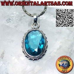 Silver pendant with faceted oval blue topaz surrounded by balls