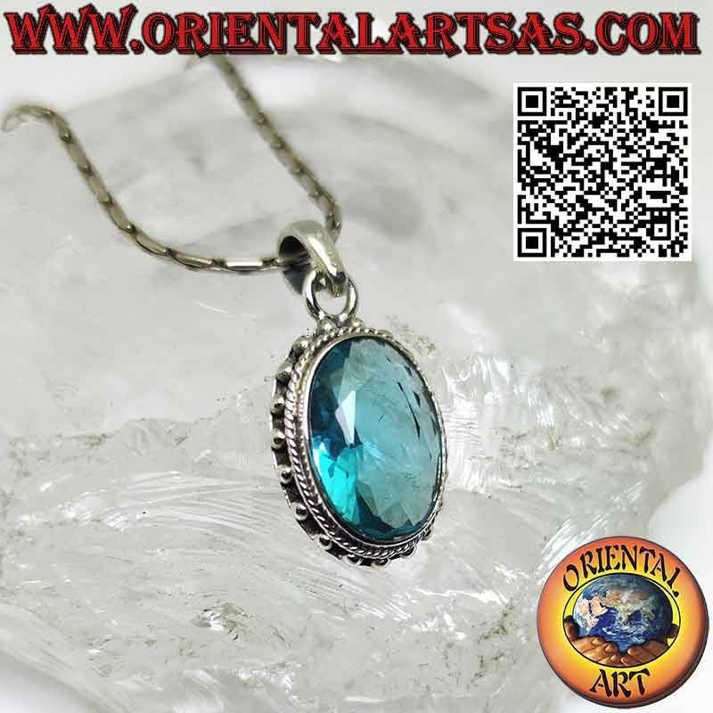 Silver pendant with faceted oval blue topaz surrounded by balls