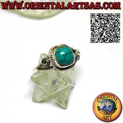 Silver ring with cabochon turquoise surrounded by intertwining and asymmetrical spiral on the sides