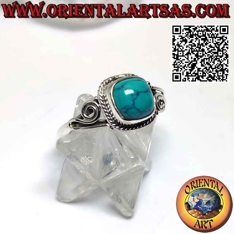 Silver ring with cabochon turquoise decorated with intertwining and spiral