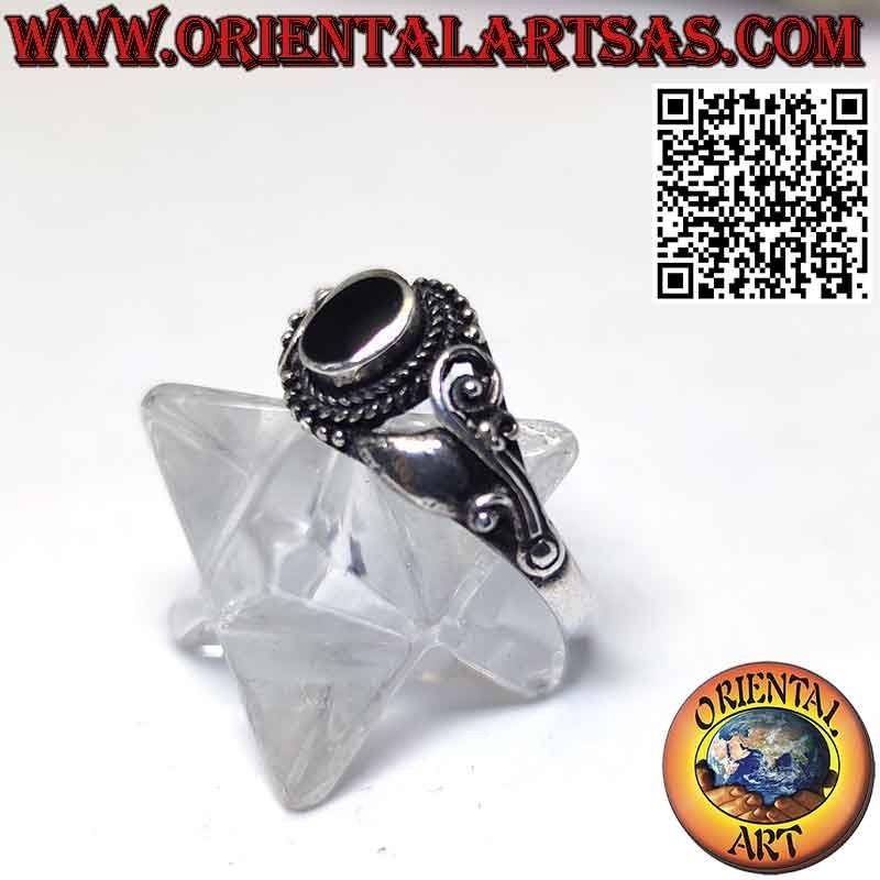 Silver ring with oval onyx and decorated with lilac flowers on the sides