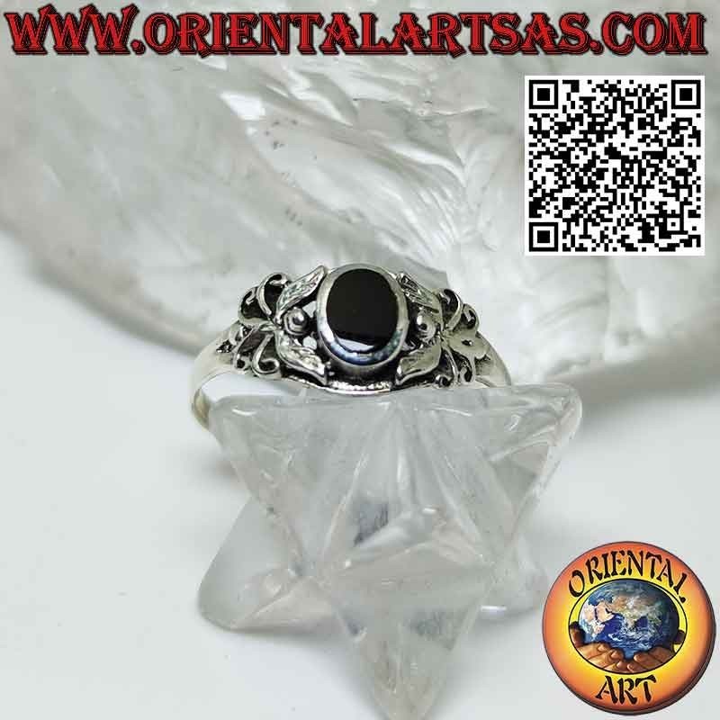 Silver ring with oval onyx and stylized butterfly on the sides