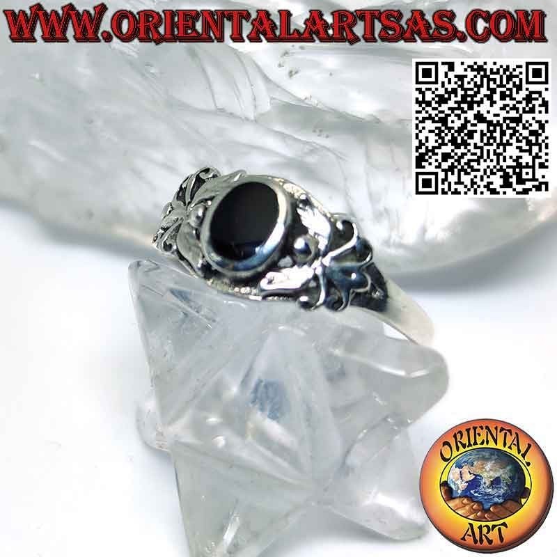 Silver ring with oval onyx and stylized butterfly on the sides
