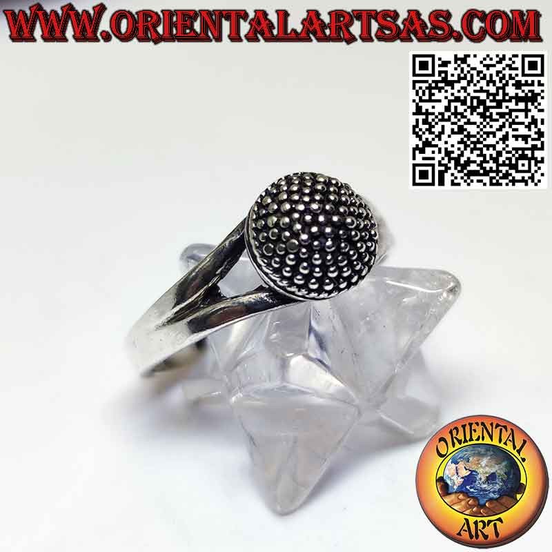 Silver ring with a handmade hemisphere studded with dots