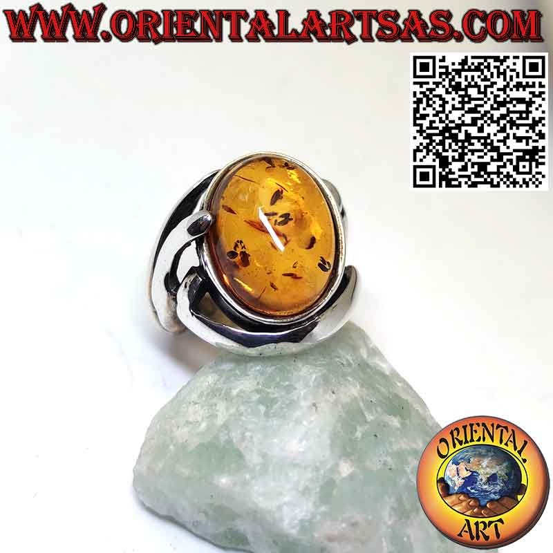 Silver ring with oval Baltic amber in a wraparound setting