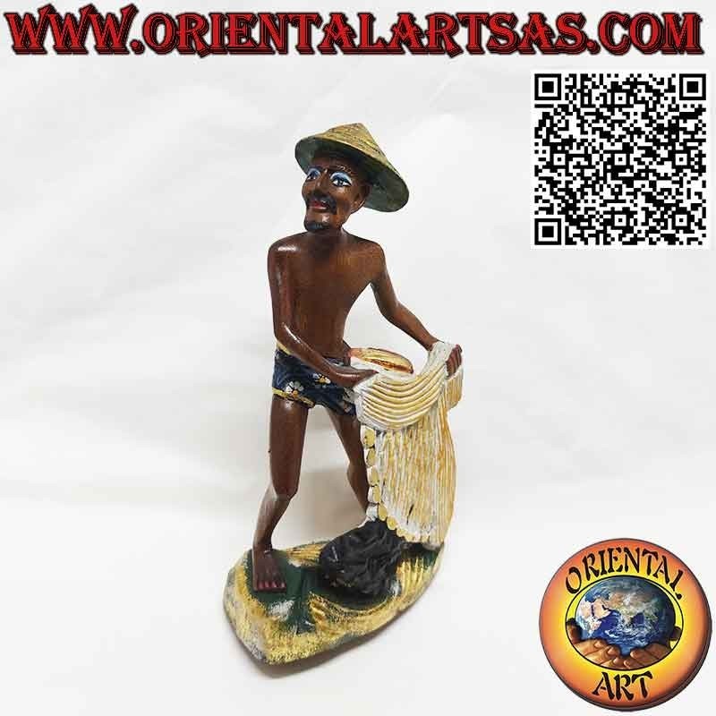 Beautiful and refined wooden sculpture of a fisherman with a net