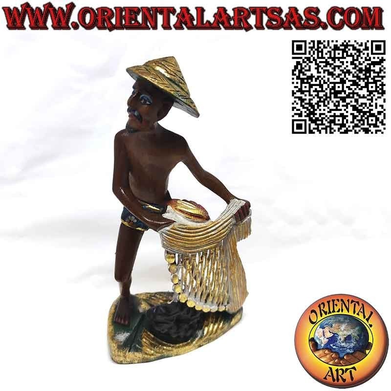 Belle et raffinée sculpture en bois d'un pêcheur au filet