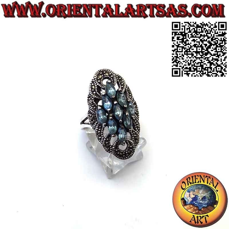 Anello in argento spoletta con 9 topazio azzurro a navetta e marcasite