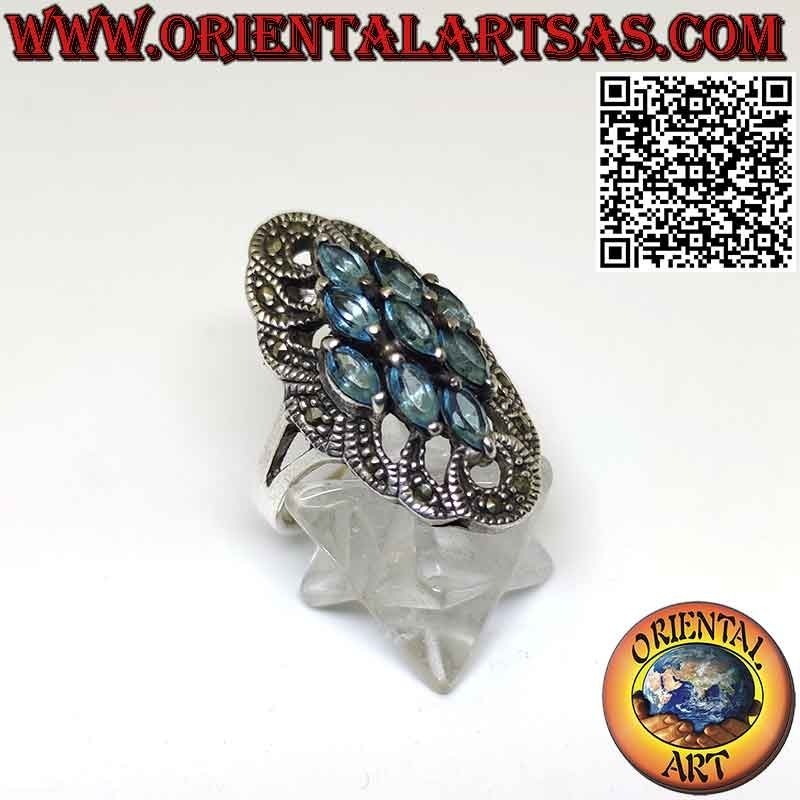 Anillo carrete de plata con 9 topacios azules lanzadera y marcasitas