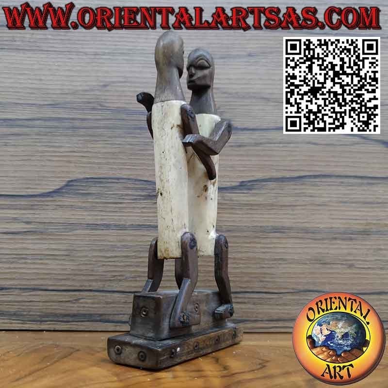 Sculpture couple in love Dayak Borneo in tribal primitive ebony bone