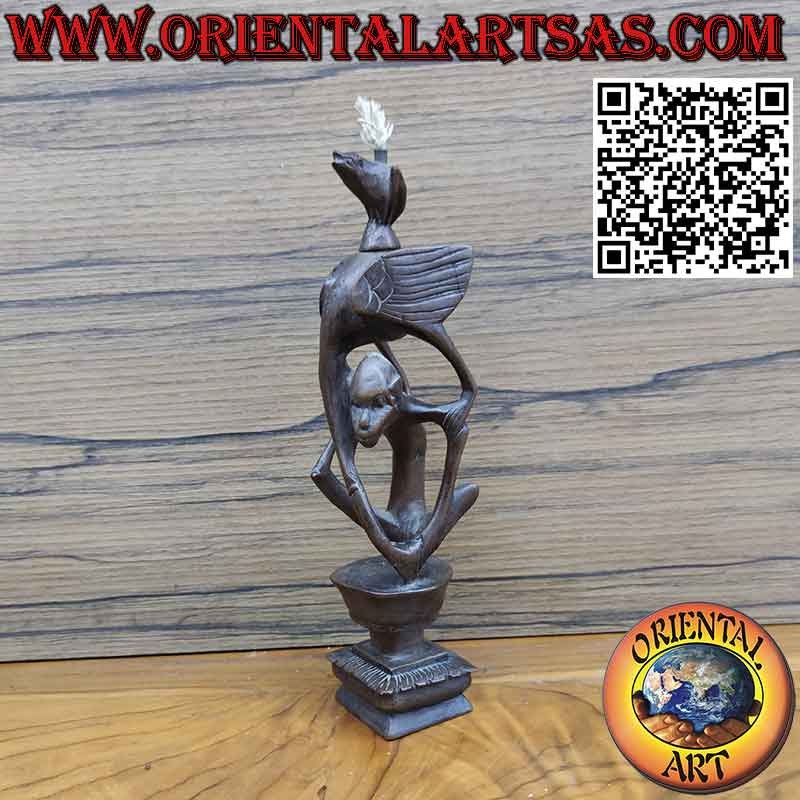 Rare ebony sculpture of a man, a pelican and an illuminated bat