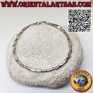 Bracciale in argento con cilindri e prisma infilati fatto dai Karen