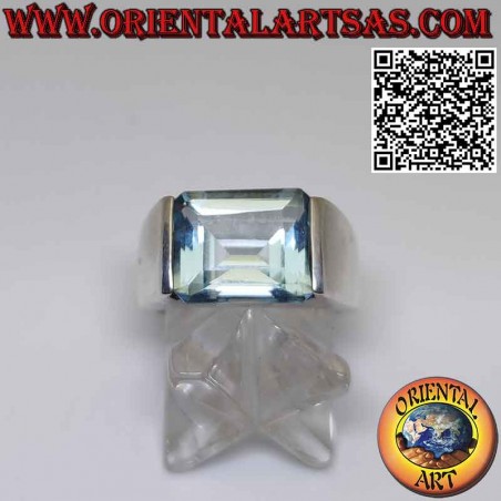 Silver ring with horizontally embedded rectangular blue topaz