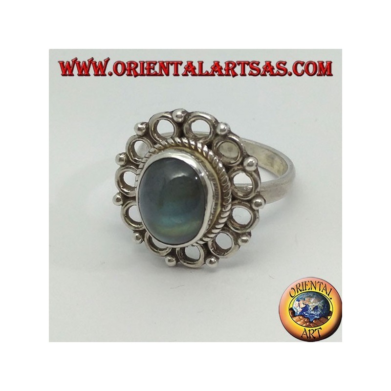 Silver ring, with oval rainbow moon stone and rim of circles