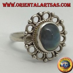 Silver ring, with oval rainbow moon stone and rim of circles