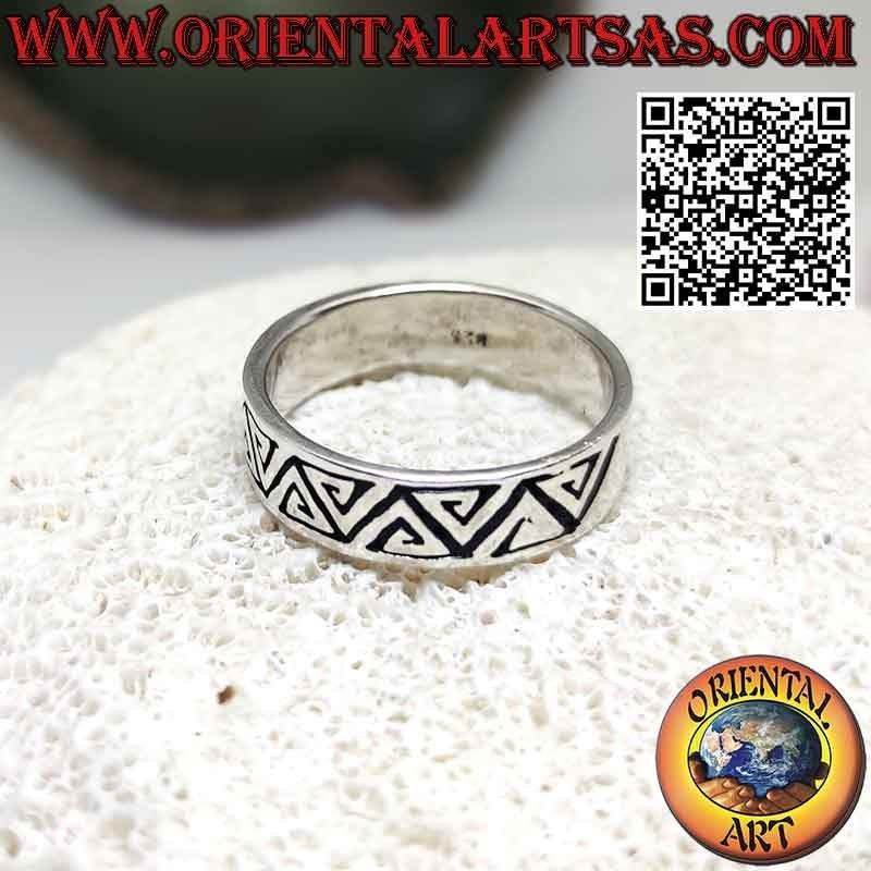 Silver band ring engraved with opposing triangular spirals
