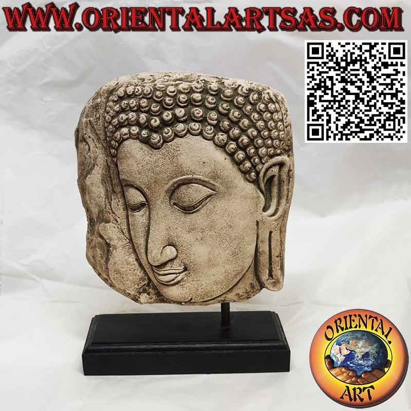 Scultura in pietra della faccia di Buddha di profilo con base in legno