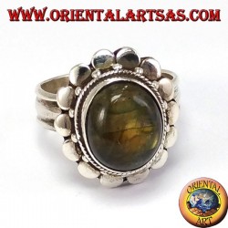 Silver ring with studded border with oval labradorite