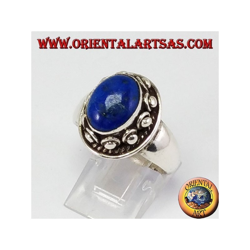 Silver ring with studSilver ring with studs around the box, with oval natural lapis lazuli