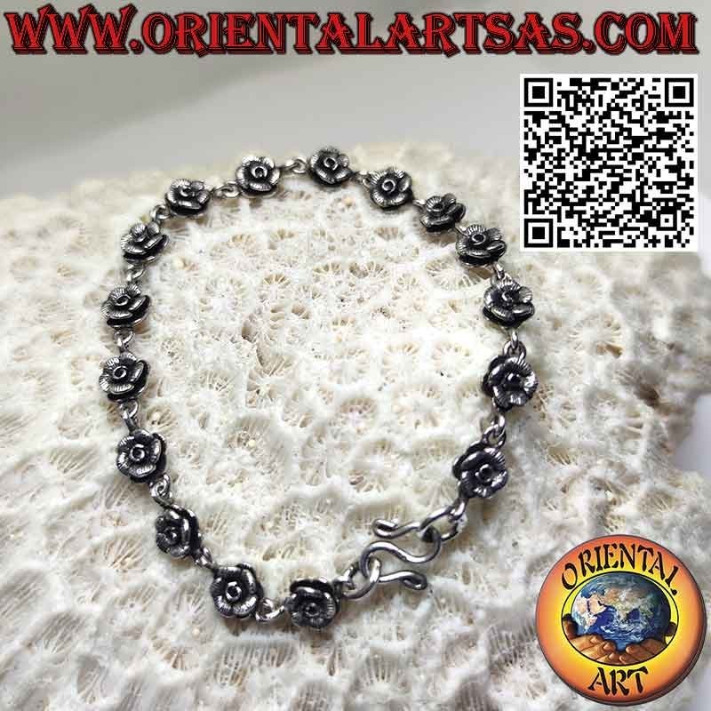 Bracelet avec une rangée de seize roses en argent 925 ‰