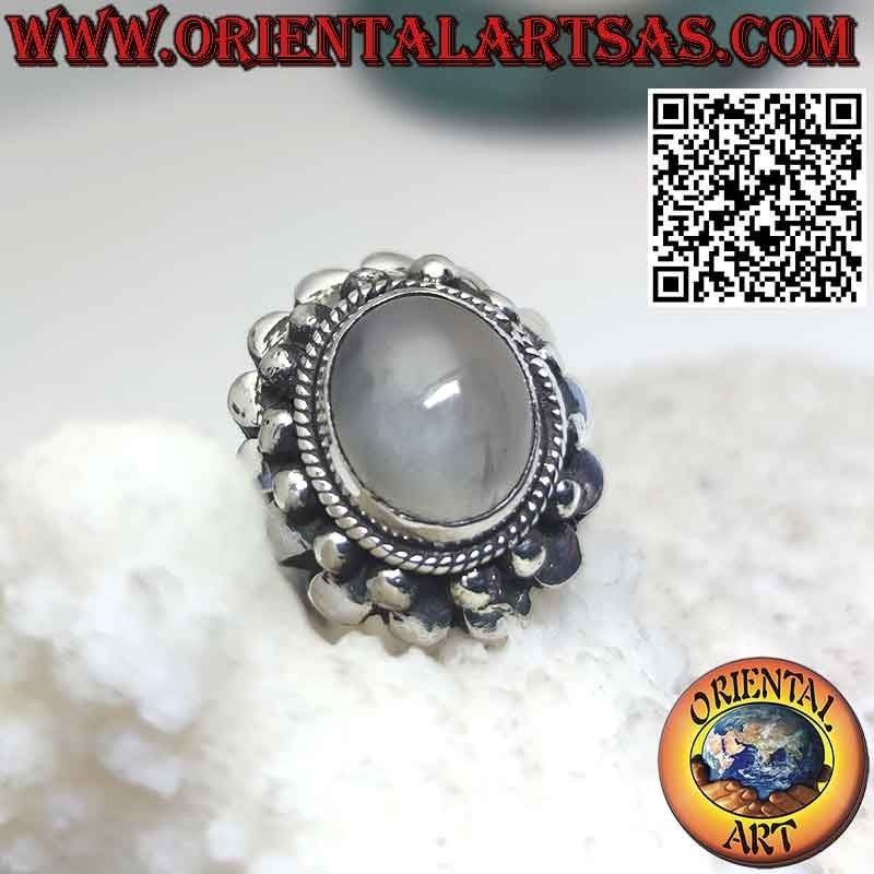 Silver ring with natural moonstone surrounded by spheres
