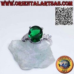 Silver ring with oval emerald on asymmetric setting and zircons
