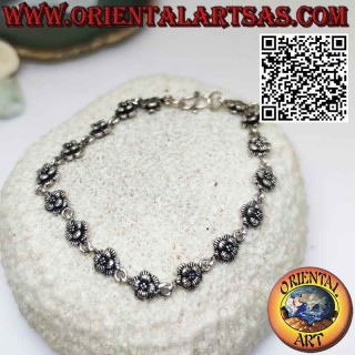 Bracelet with sixteen roses in 925 ‰ silver in rows joined by a ring