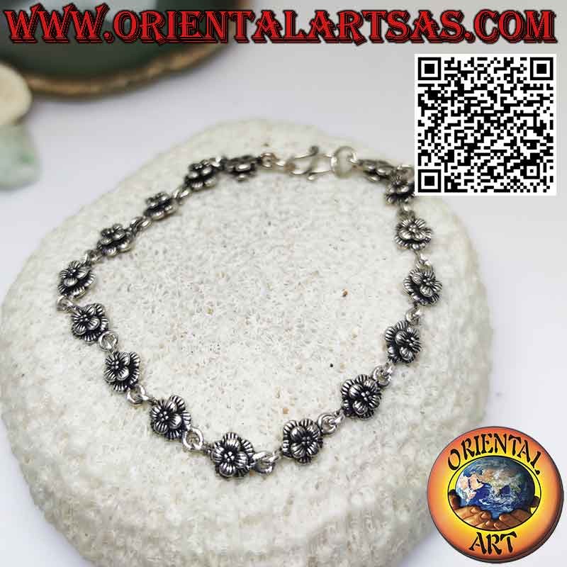 Bracelet with sixteen roses in 925 ‰ silver in rows joined by a ring