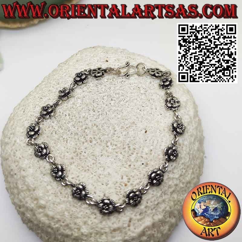 Bracelet with sixteen roses in 925 ‰ silver in rows joined by a ring