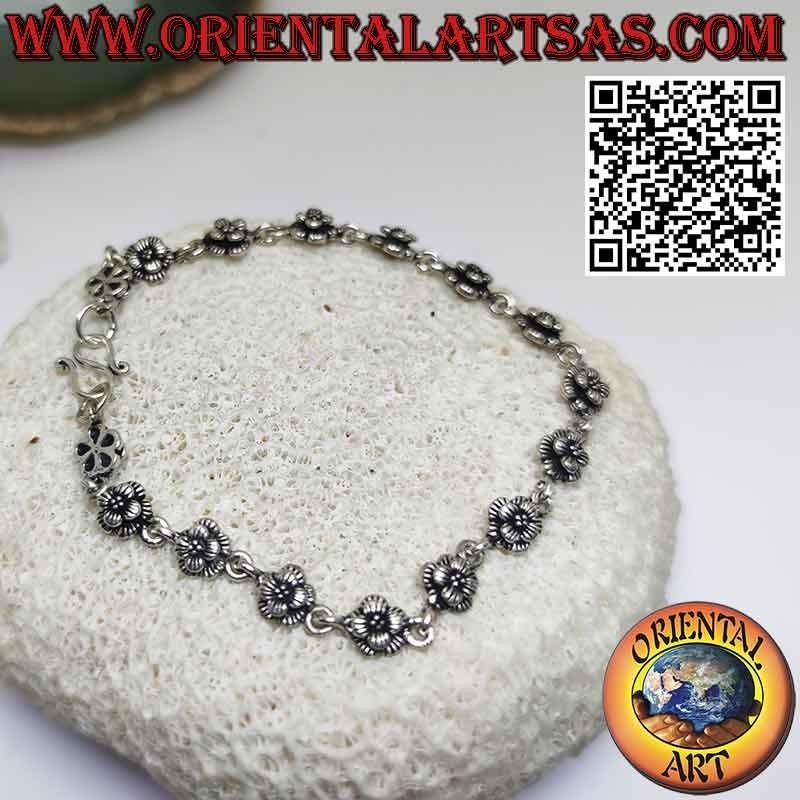 Bracelet avec seize roses en argent 925 ‰ en rangées réunies par un anneau