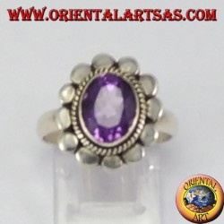 Silver ring with oval faceted natural amethyst with studded rim