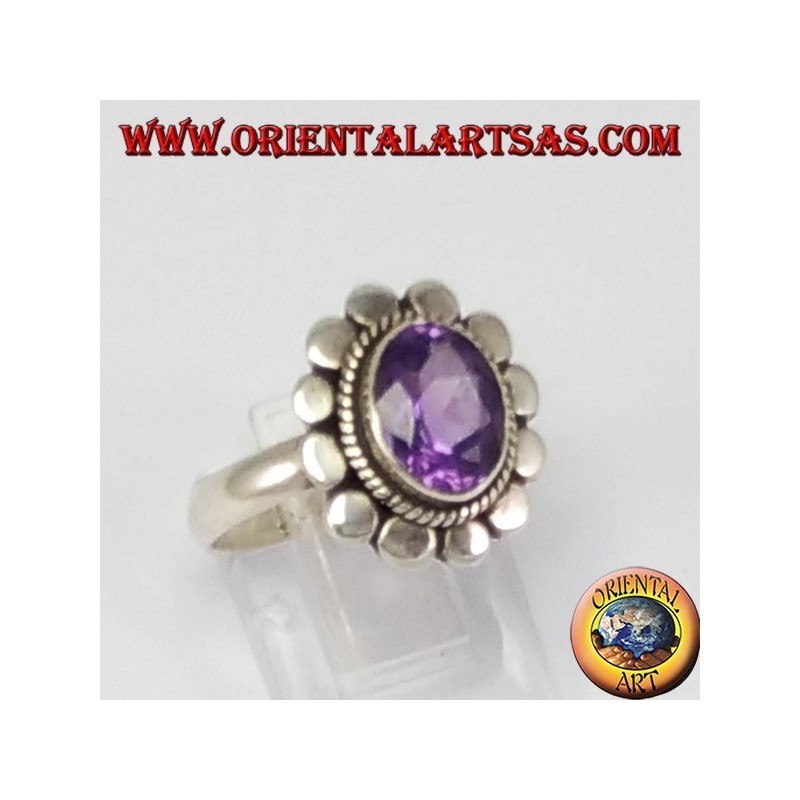 Silver ring with oval faceted natural amethyst with studded rim