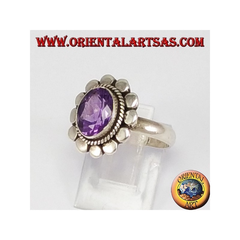 Silver ring with oval faceted natural amethyst with studded rim