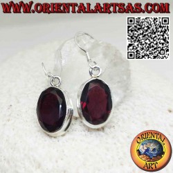 Silver earrings with a natural large oval garnet with a simple border