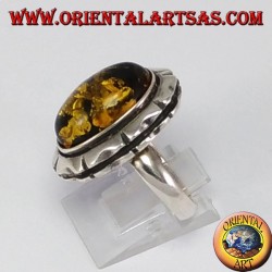 Silver ring with large green oval amber