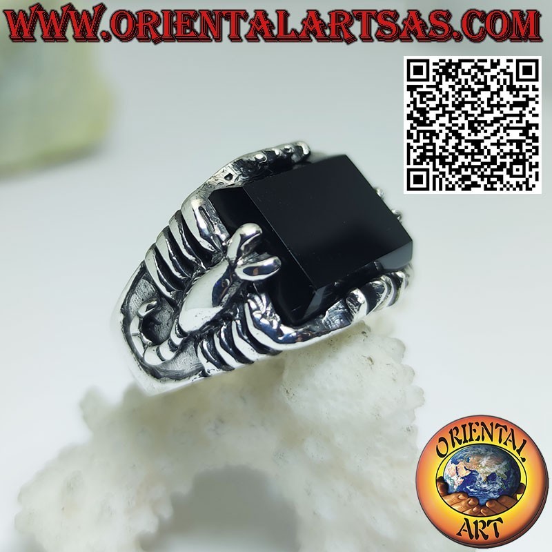 Silver ring with rectangular onyx and scorpion in high relief on the sides