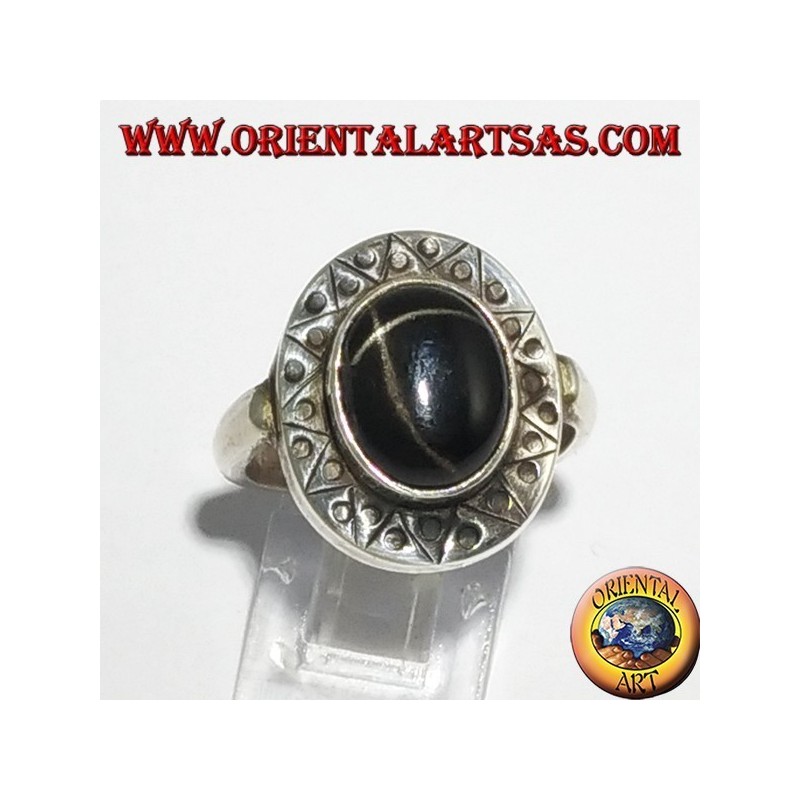 Silver ring with black star with chiselled edge