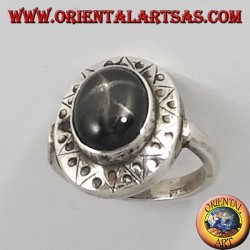 Silver ring with black star with chiselled edge