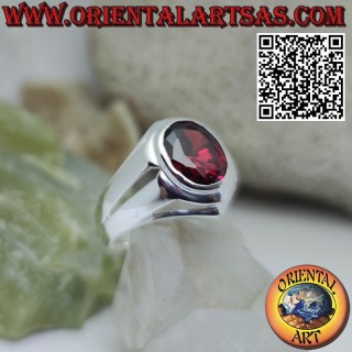 Silver ring with oval garnet and smooth setting and linear holes